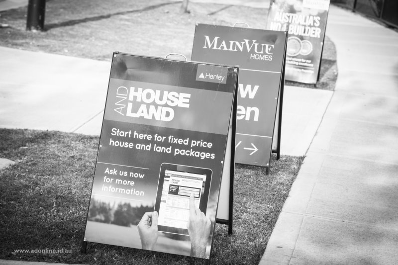 Sandwich boards advertising houses open for inspection.