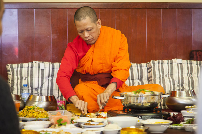 A Buddhist monk having lunch during Pchum Ben.