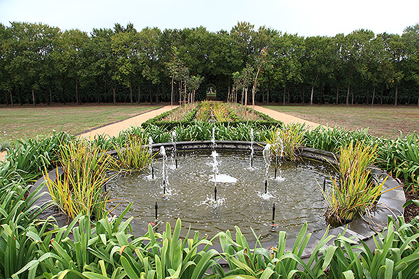 Looking along a series of ponds with fountains inside