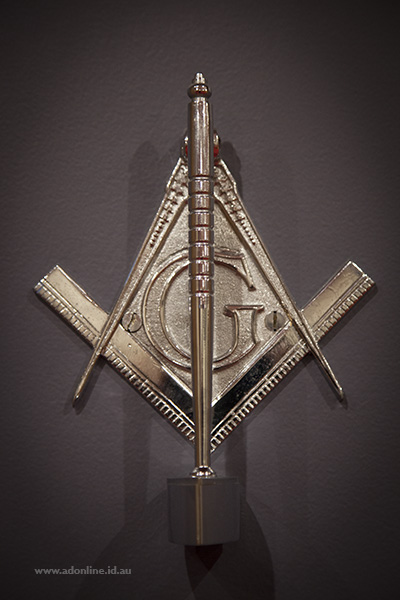 Door knocker cast in the shape of freemason logo