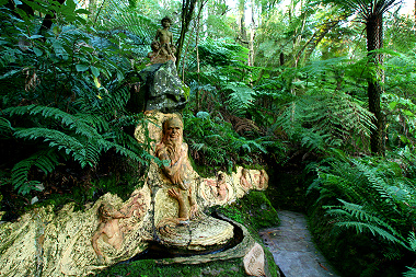 Stone carvings of aborigines in forest