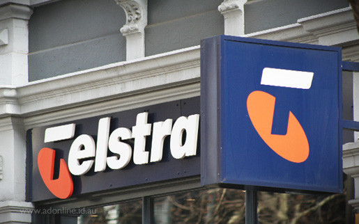 Telstra sign in front of a Telstra Shop